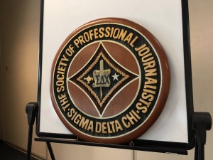 Steve Goldstein, a 44-year SPJ member, brought with him to the meeting the SPJ emblem he ordered hand-made from wood. It incorporates the old SDX name and the new Society of Professional Journalists monikers.