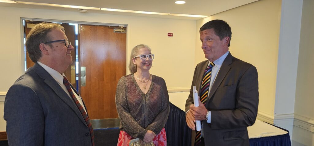 John Kelly, retired columnist for The Washington Post, before his induction into the Society of Professional Journalists Washington, DC, Pro Chapter's Washington Journalism Hall of Fame, chats with his wife Ruth Pritchard-Kelly and Mark Segraves of News4 Washington, who will introduce him as he is inducted during ceremonies for the SPJ DC Pro Chapter's annual Dateline Awards and Hall of Fame dinner on June 11, 2024, in the National Press Club Ballroom. Photo by Randy Showstack